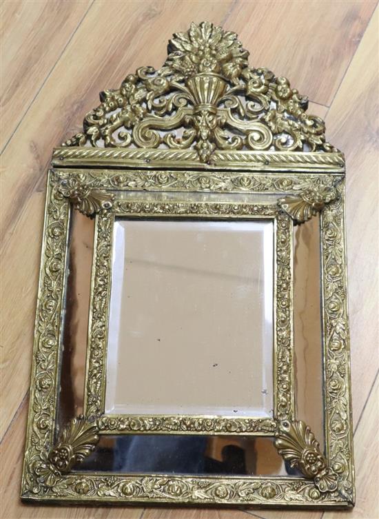 A 17th century style embossed brass pier glass, height 57cm